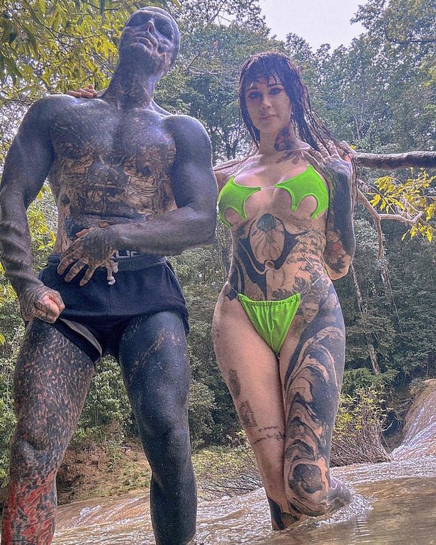 'Black alien' poses with new girlfriend – and he's quizzed on penis body mods